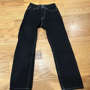 Black BDG cowboy jeans with white stitching